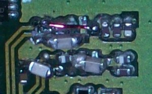 RX filters replaced with capacitors Closeup of the hacked-up capacitors